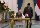 PM Modi signs guestbook upon meeting Indonesian Prez Subianto at Istana Merdeka