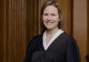 US Justice details safety risks, recalls explaining bulletproof vest to son